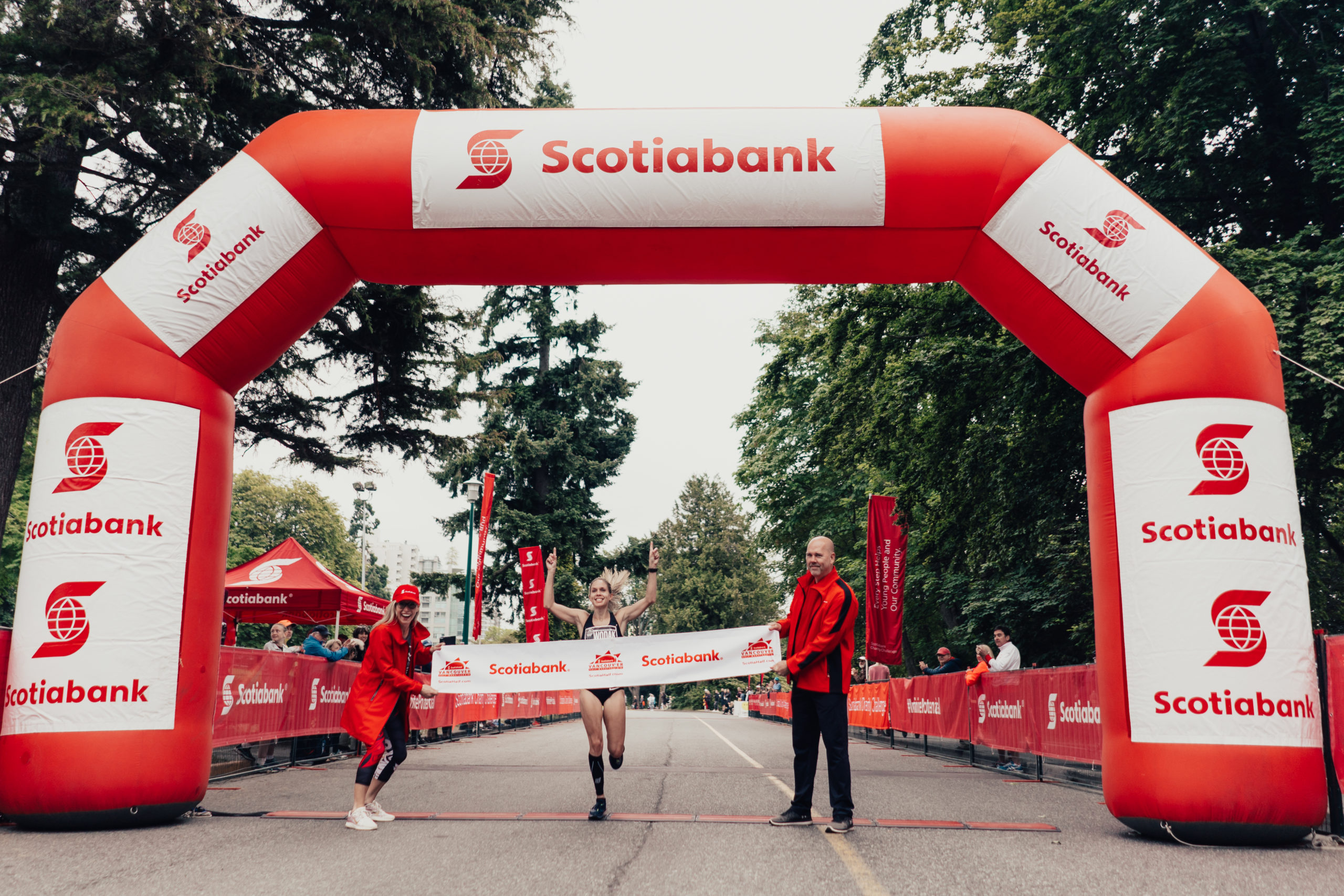 Natasha Wodak crossing the finish line of the Scotiabank Vancouver Half Marathon